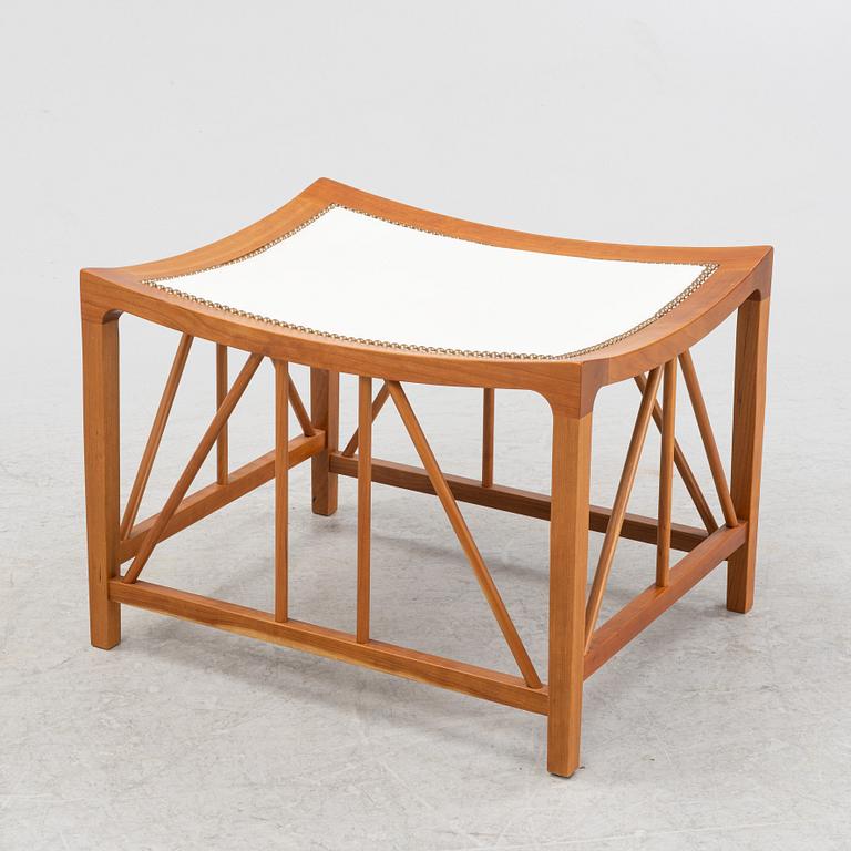 Josef Frank, a model 1063 cherry wood stool, Firma Svenskt Tenn, 21st Century.