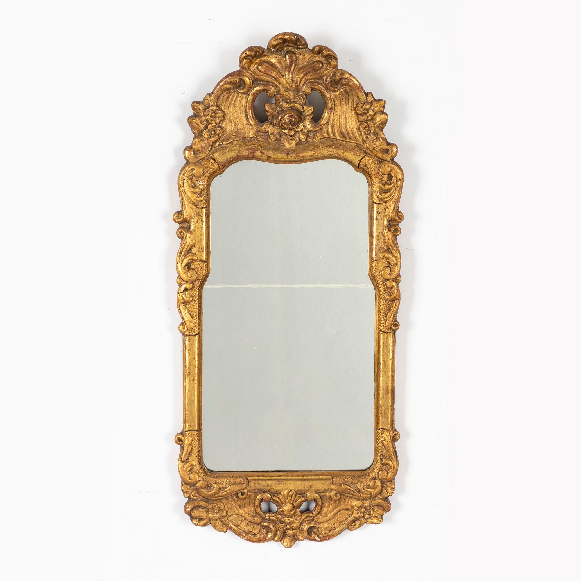 A Rococo mirror, 18th Century.