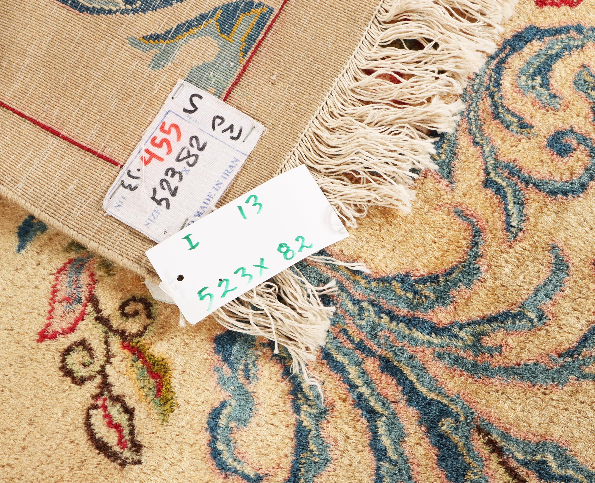 A semi-antique Keshan runner, c. 523 x 82 cm.