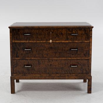 A 1930's stained birch chest of drawers.