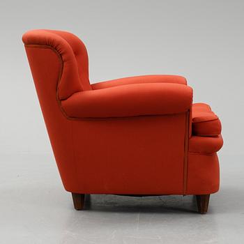 Josef Frank, a model 568 easy chair by Svenskt Tenn, Sweden.