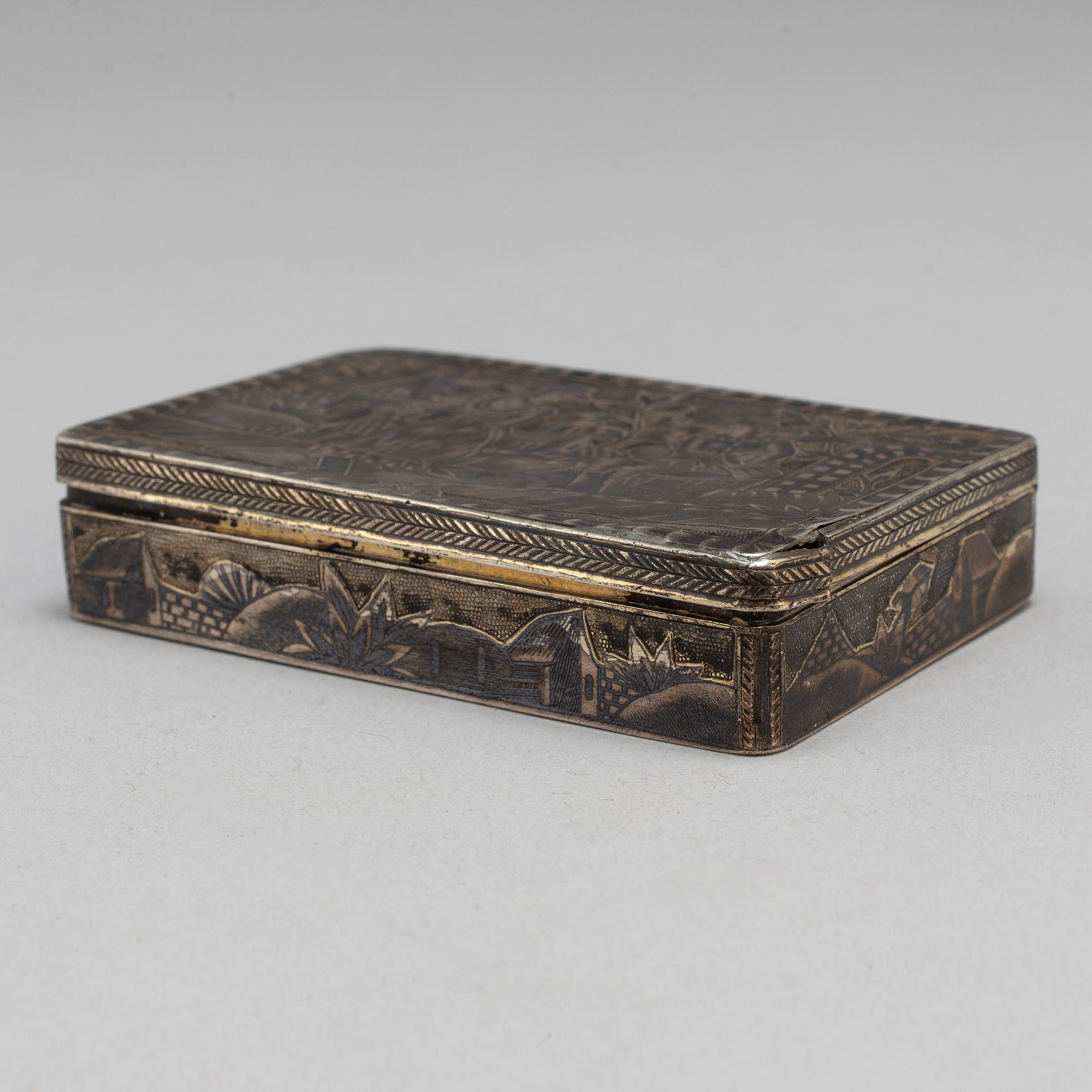 A Russian mid 19th century silver-gilt and niello snuff-box, mark of Moscow.
