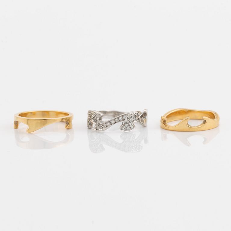 Three 18K gold and brilliant cut diamond rings.