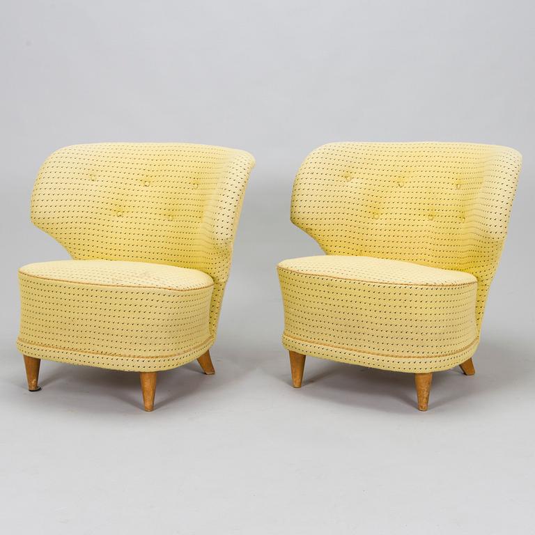 A pair of mid-20th-century armchairs.