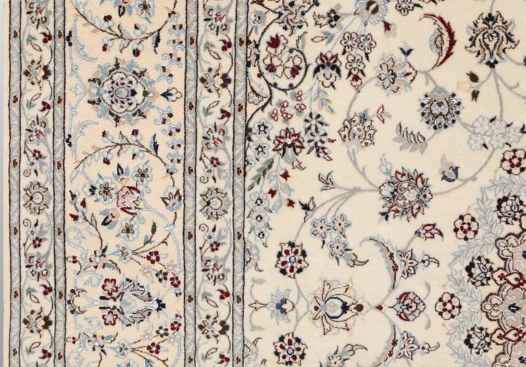 A Nain part silk carpet, c. 207 x 208 cm.