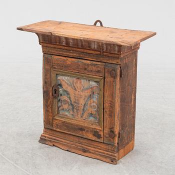 A small painted wall cabinet, 19th Century.