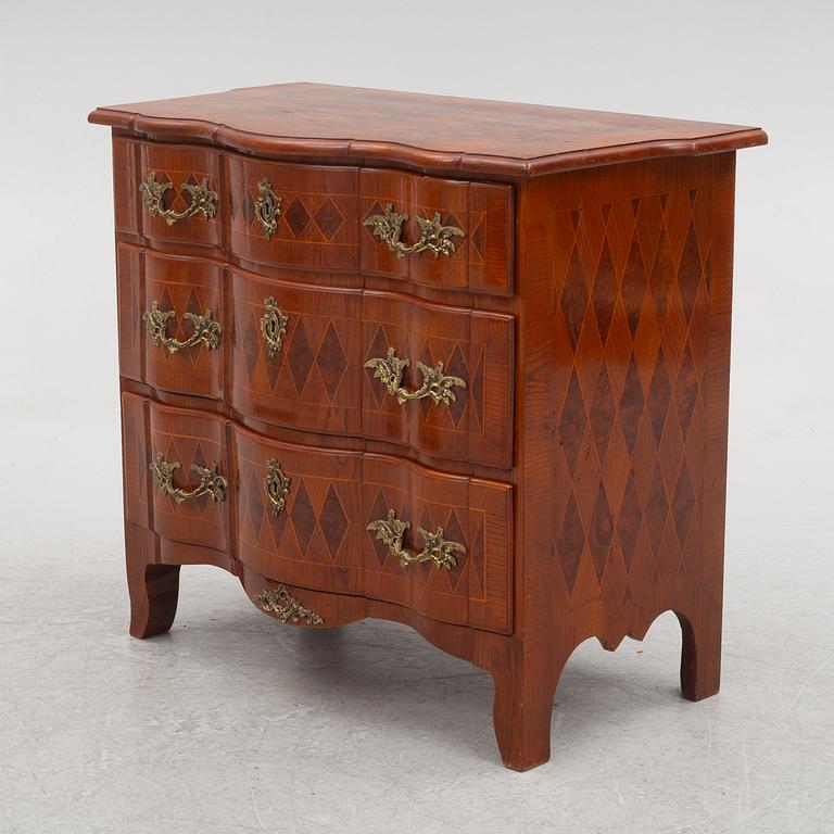 A Baroque style chest of drawers, circa 1900.
