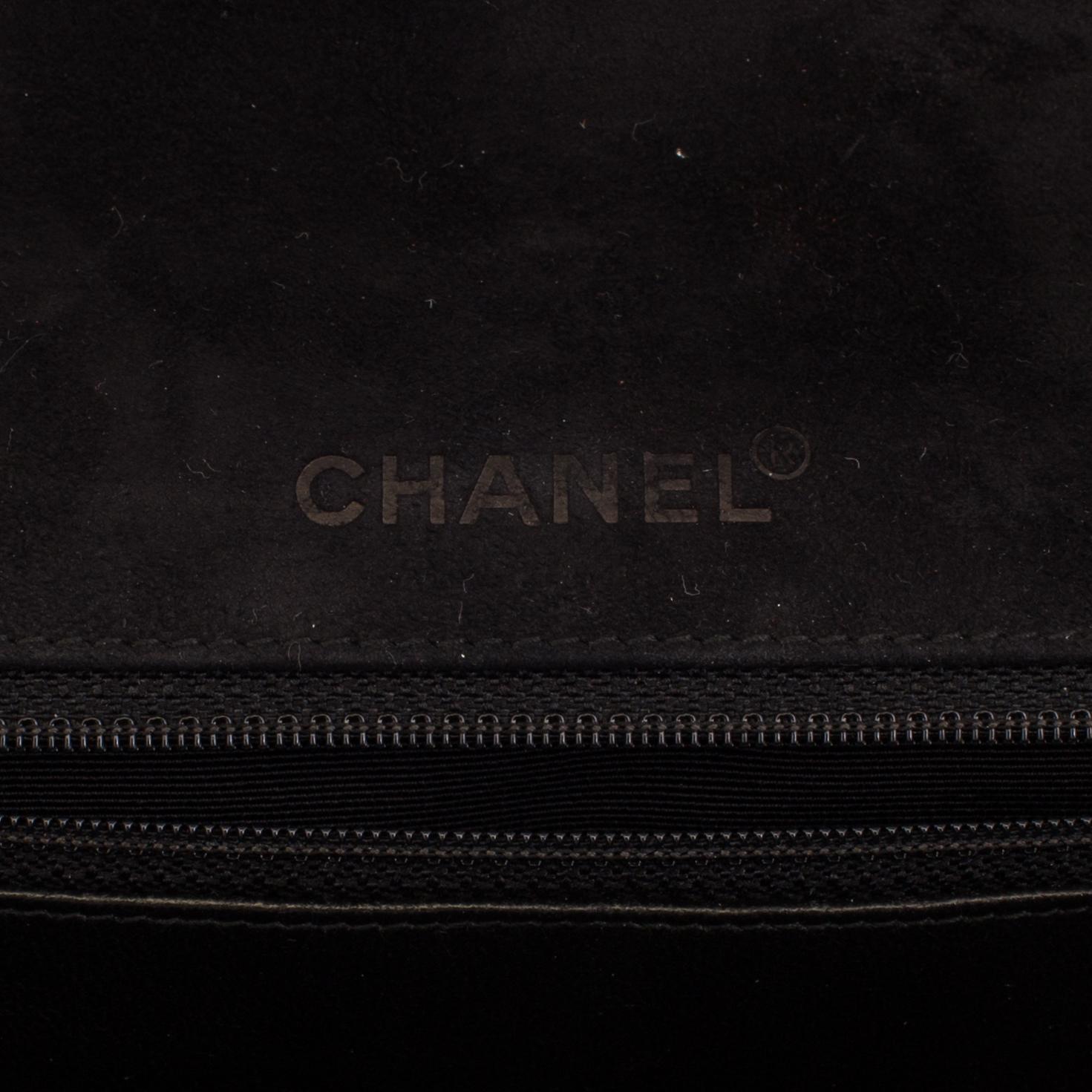 A CHOCO BAR SUEDE FLAP BAG BY CHANEL.