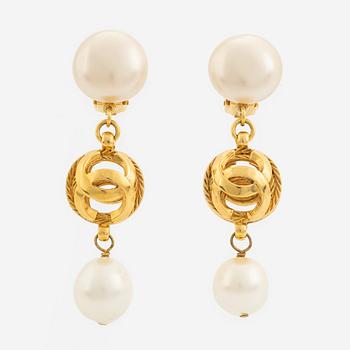 Chanel, a pair on gold tone and pearl clip-on earrings.