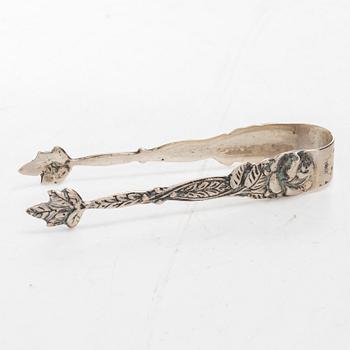 A silver sugar bowl, creamer and sugar tongs, 20th century.