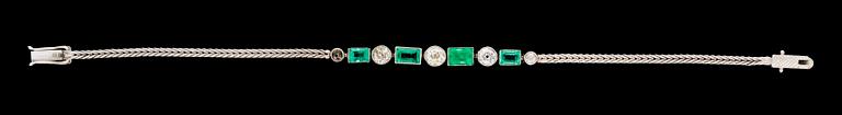 A gold, emerald and diamond bracelet.