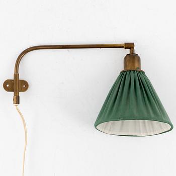 Josef Frank,  a wall/ bed light, brass,  Firma Svenskt Tenn.