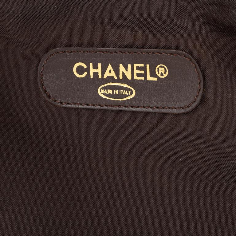 Chanel, A brown leather weekendbag, 1986 - 1988.