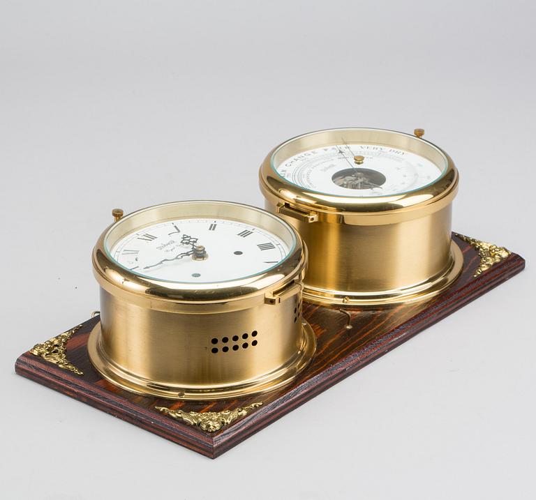 A BRASS MARINE CLOCK AND BAROMETER BY STOCKBURGER.