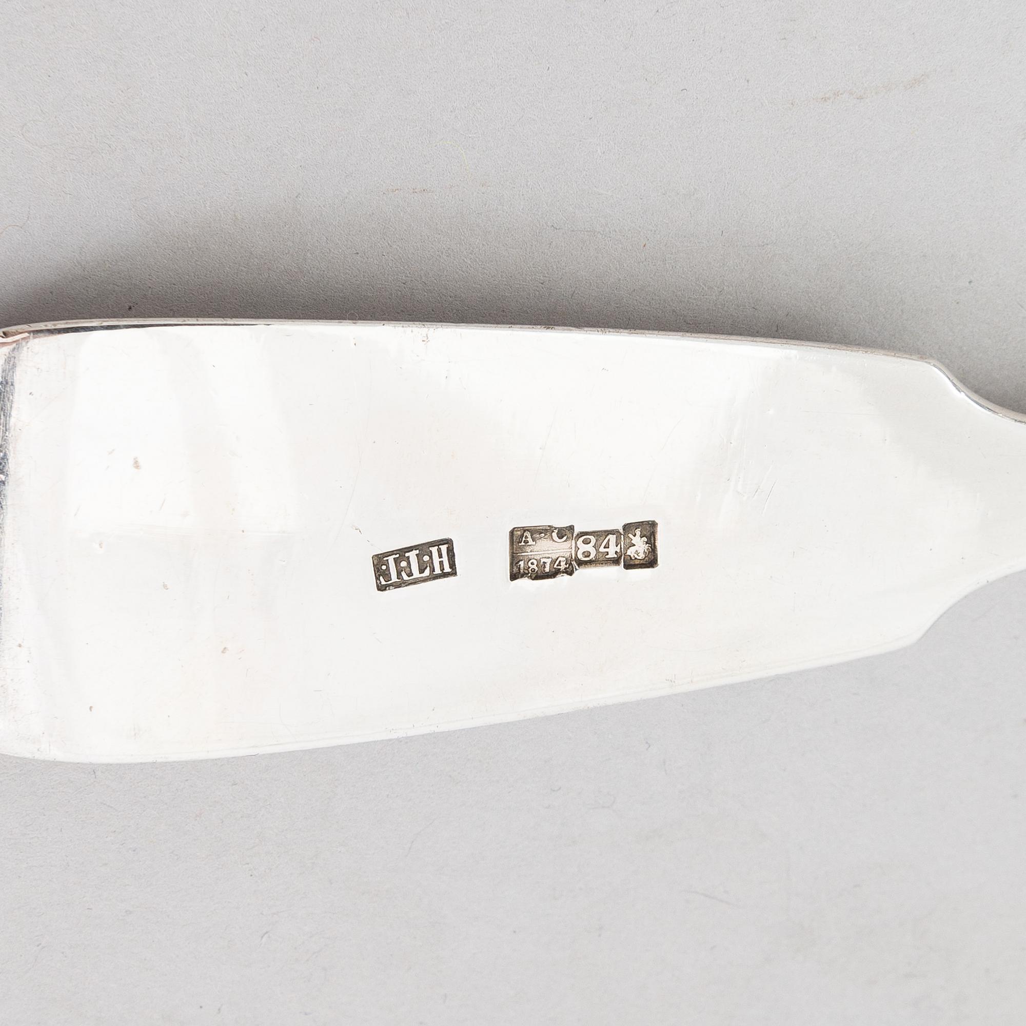 A Russian silver soup ladle and two pairs of silver spoons, Moscow 1874 and Saint Petersburg 1868 and 1887.