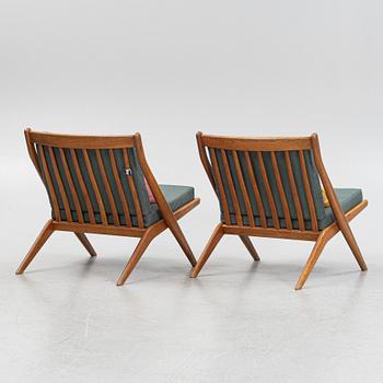 Folke Ohlsson, a pair of oak Frisco easy chairs, Nodafors, 1960s.