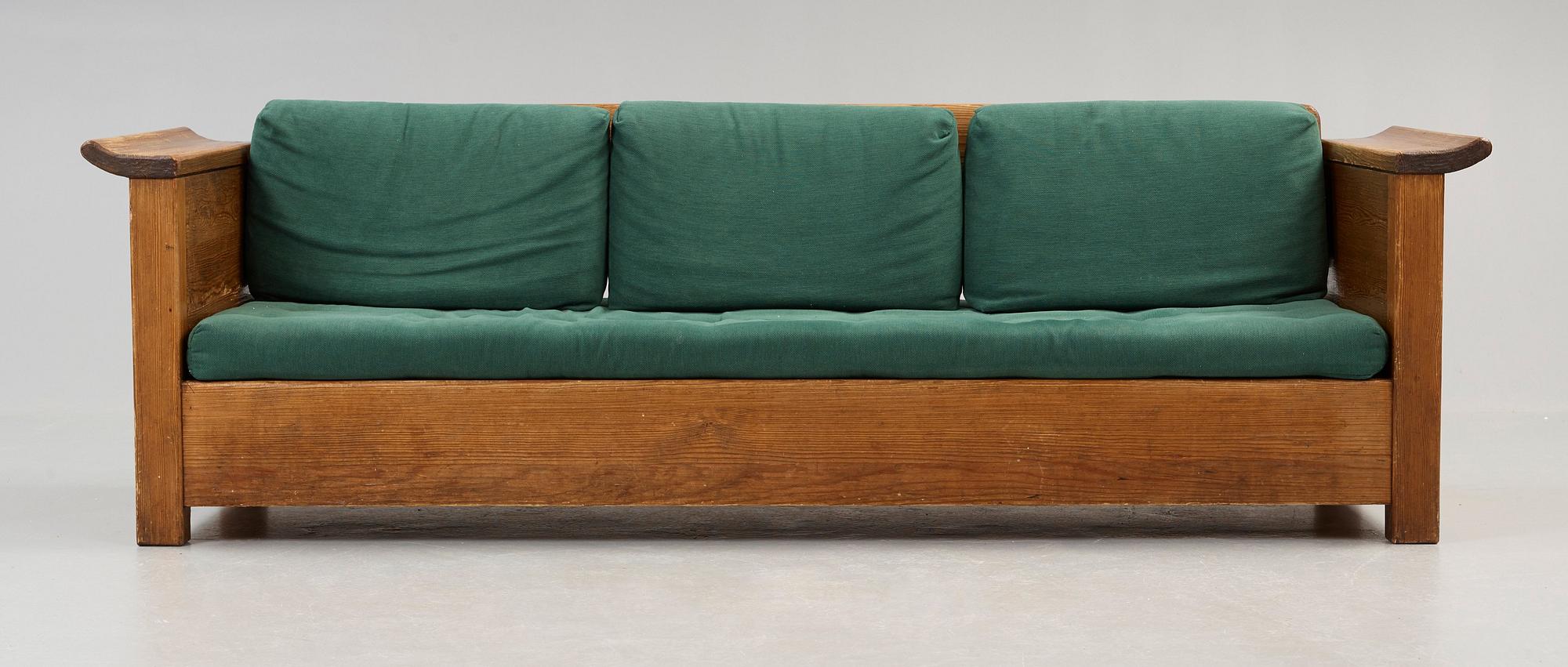 An Axel Einar Hjorth stained pine sofa 'Sandhamn', by Nordiska Kompaniet ca 1929.