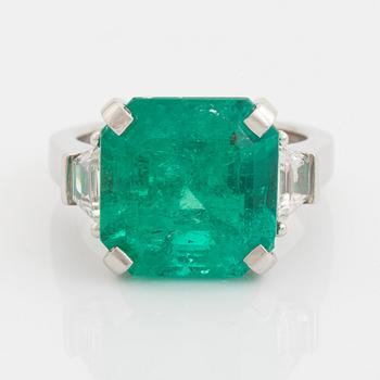 Emerald and trapezoid cut diamond ring.