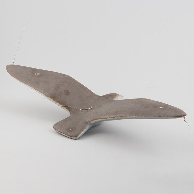 A stoneware sculpture of a sea bird, unsigned.