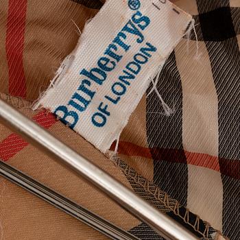 Burberry, a Nova Check tote bag and umbrella.