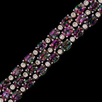 ARMBAND, sterlingsilver, vita och färgade topaser tot ca 28.00 ct.
