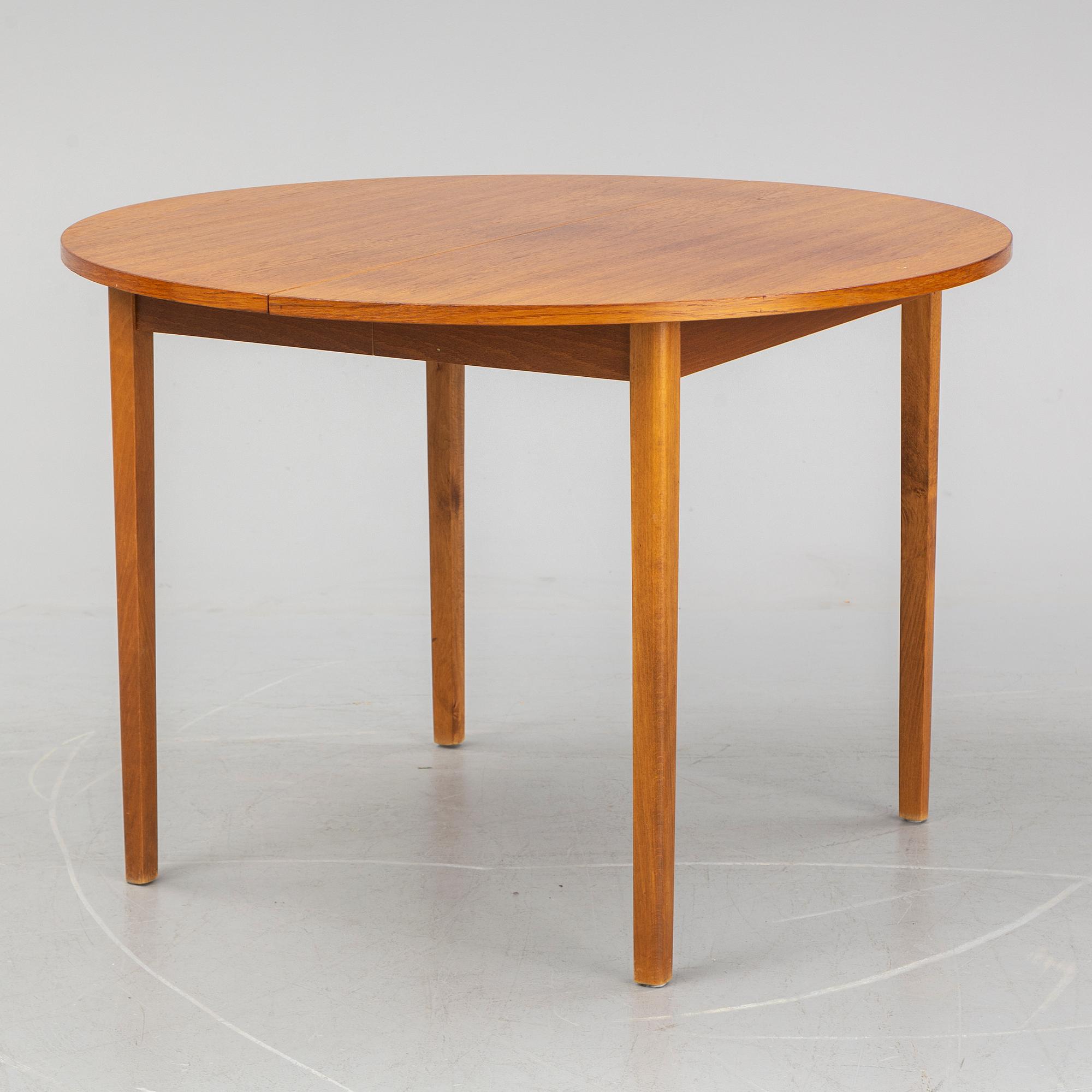 A teak veneered table, second half of the 20th century.