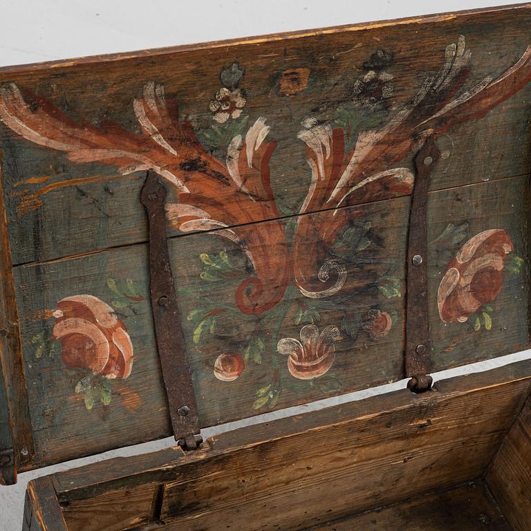 A polychrome-painted travelling case from Halland, Sweden, dated 1833.