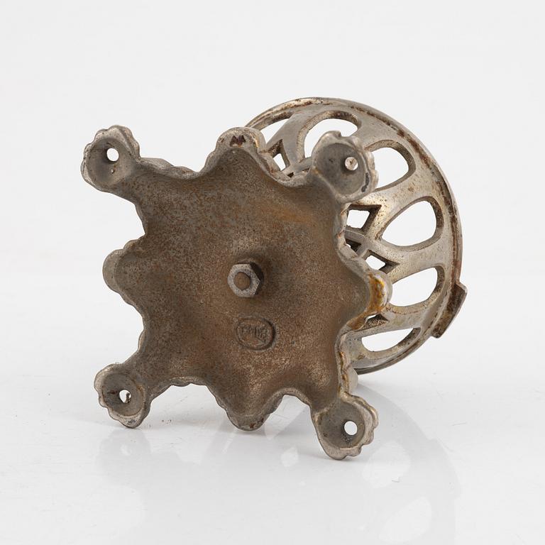 A metal string-holder, Eskilstuna, circa 1900.