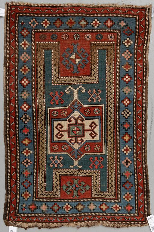 A RUG, an antique Caucasian, ca 135,5 x 93,5 cm.