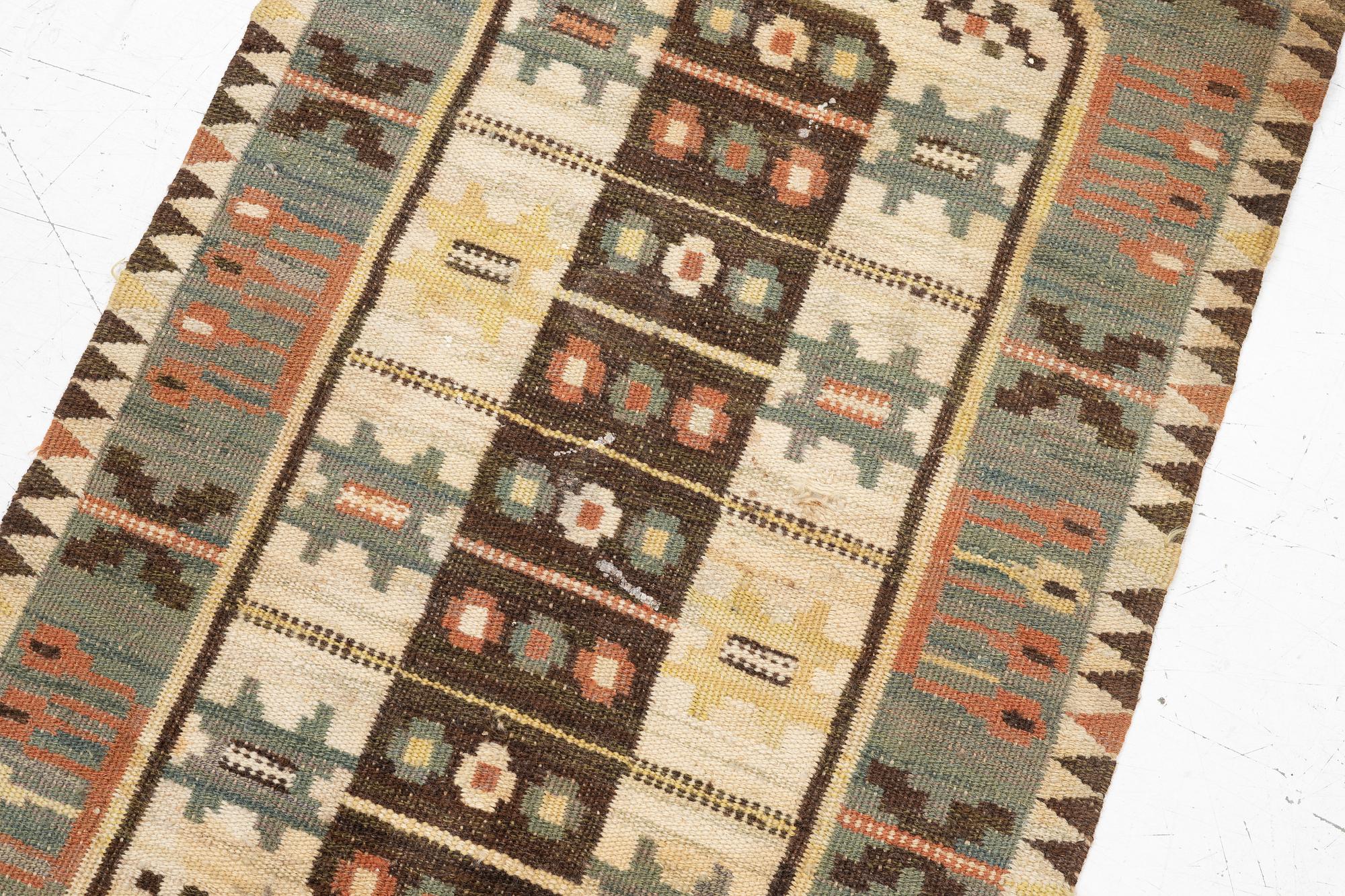 Märta Måås-Fjetterström, a textile, 'Rabatten', flat weave, ca 100 x 50 cm, signed MMF.