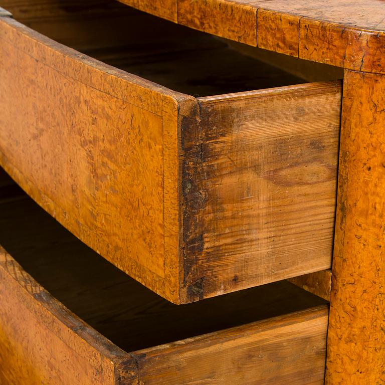 A bureau veneered in Karelian birch, mid-19th century.