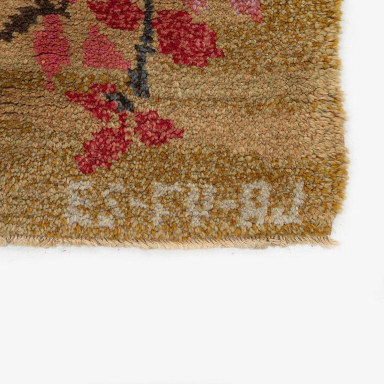 A knotted pile carpet, c. 275 x 177 cm, signed ES-FV-AJ.