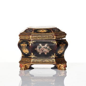 A Chinese lacquered tea caddy with pewter boxes, Qing dynasty, 19th Century.