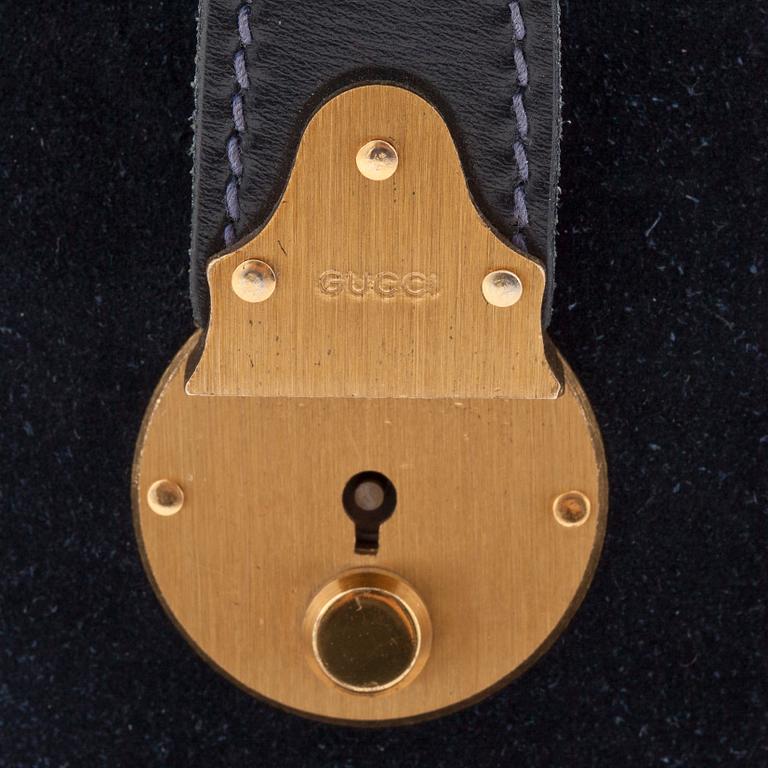 GUCCI, a blue suede and leather weekendbag.