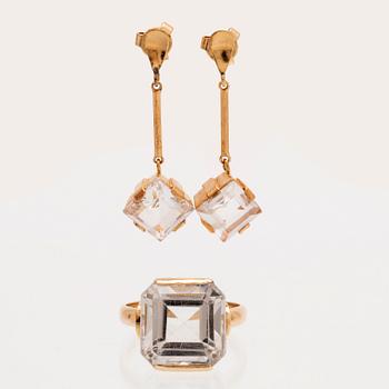 A set of 18K gold earrings and ring with faceted rock quartz crystal.