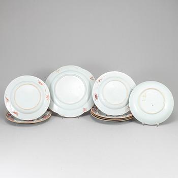 A set of six famille rose dinner plates and a serving dish, Qing dynasty, Qianlong (1736-95).