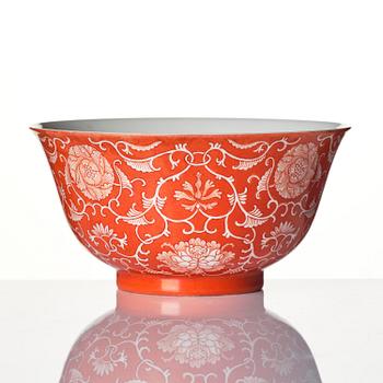 A coral red reserve decorated floral bowl, Qing dynasty with Qianlong mark.