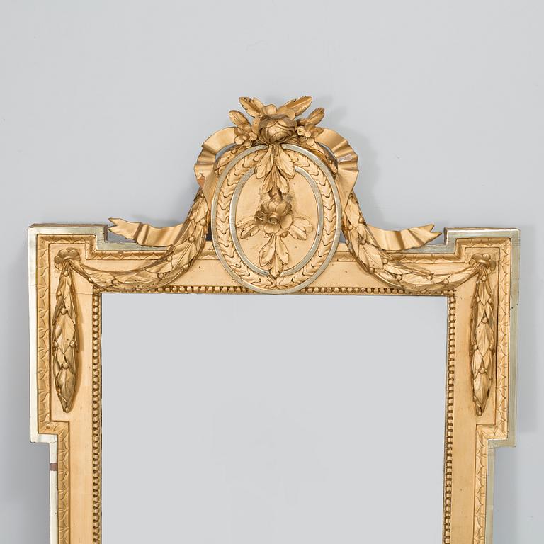 A gustavian mirror by Per Westin, signed PW and with the Stockholm hallmark 1777.