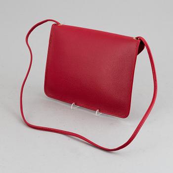 YVES SAINT LAURENT, a red leather bag.