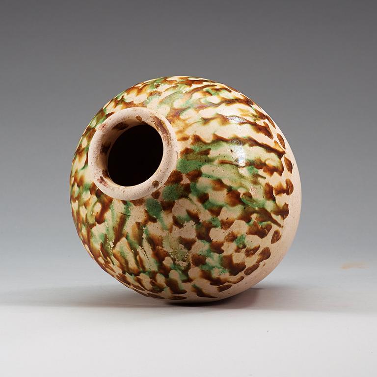 A Sancai-glazed pottery jar, Tang Dynasty (618-907).