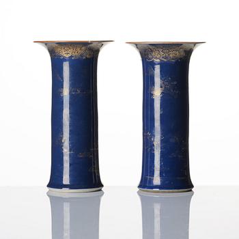 A pair of powder blue and gold 'trumpet' vases, Qing dynasty, 18th century.