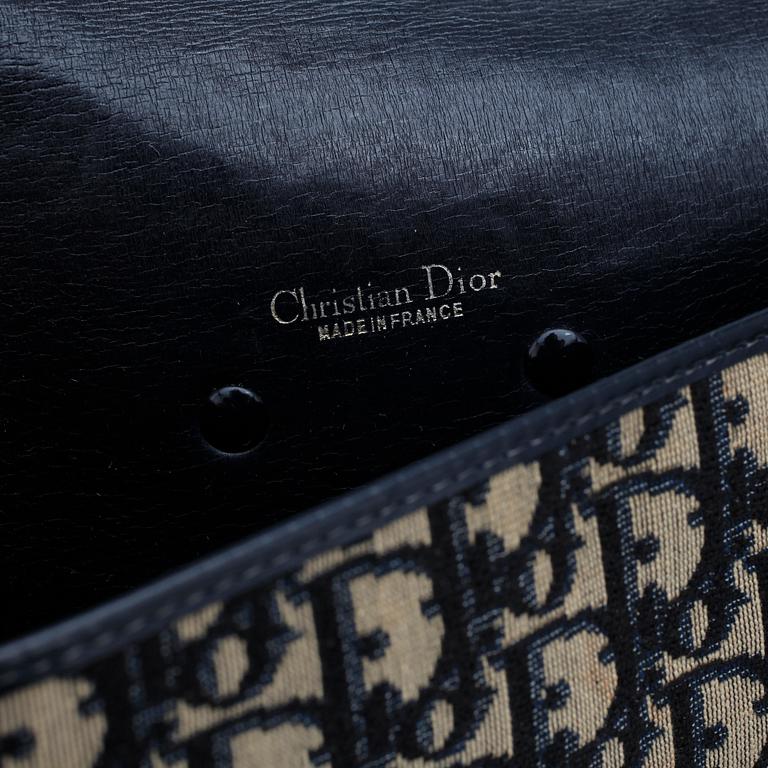 CHRISTIAN DIOR, a monogram canvas clutch bag and necklace.