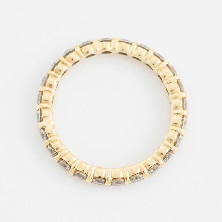 Brilliant cut diamond eternity ring.
