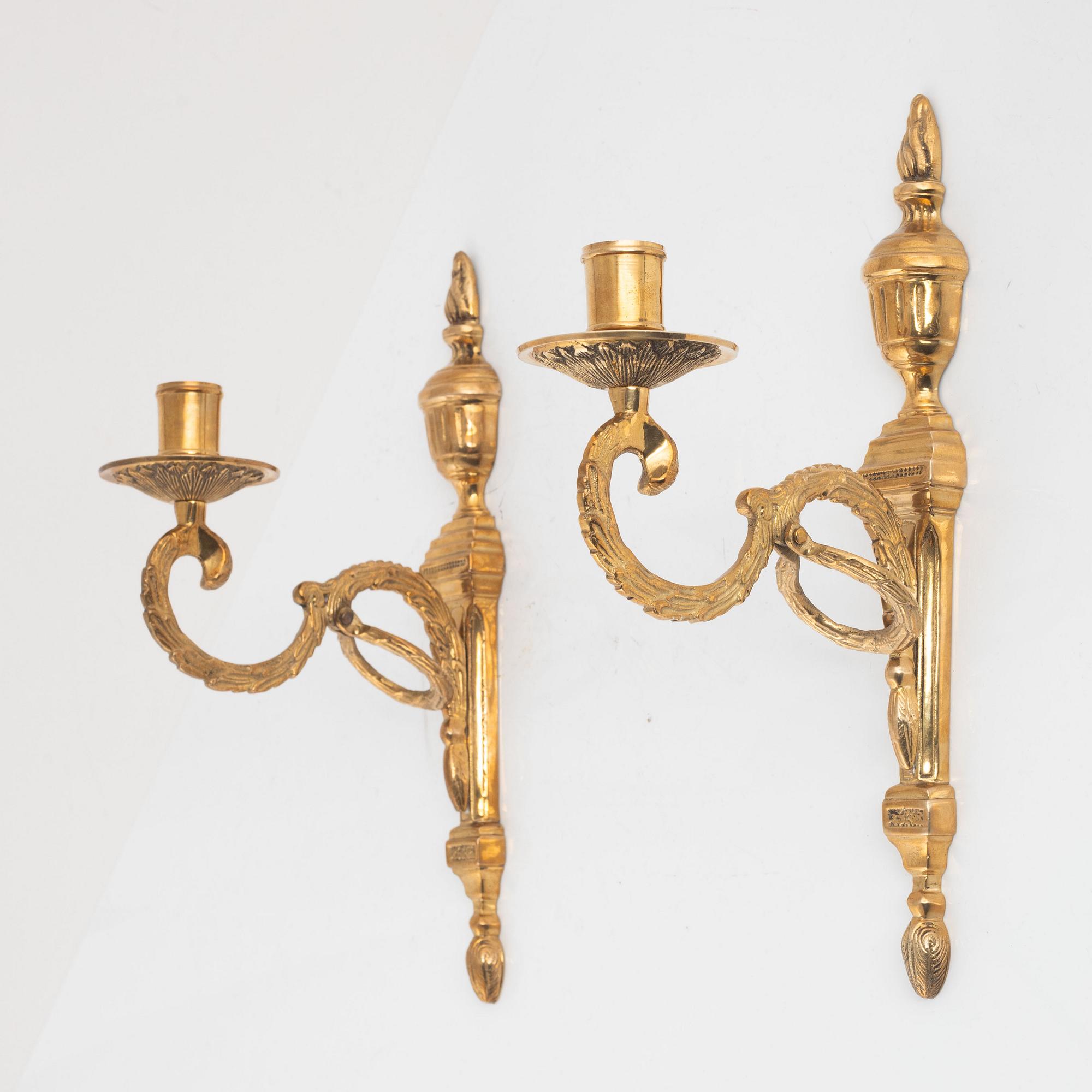 A pair of 'Törne' brass one-light wall ligths from IKEA's 18th Century collection.
