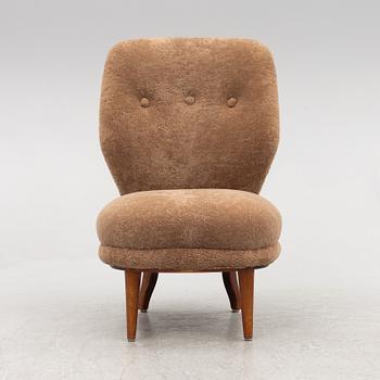 A mid 20th century easy chair,.