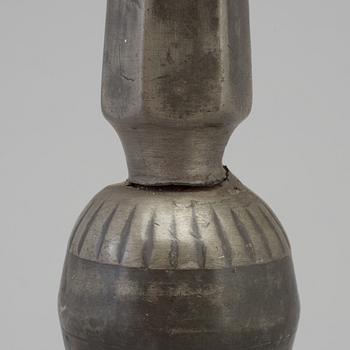 A 17th century pewter candlestick.