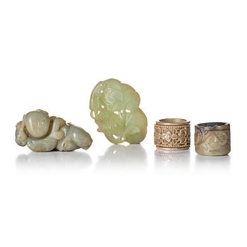 1189. Two archers rings and two nephrite carvings.