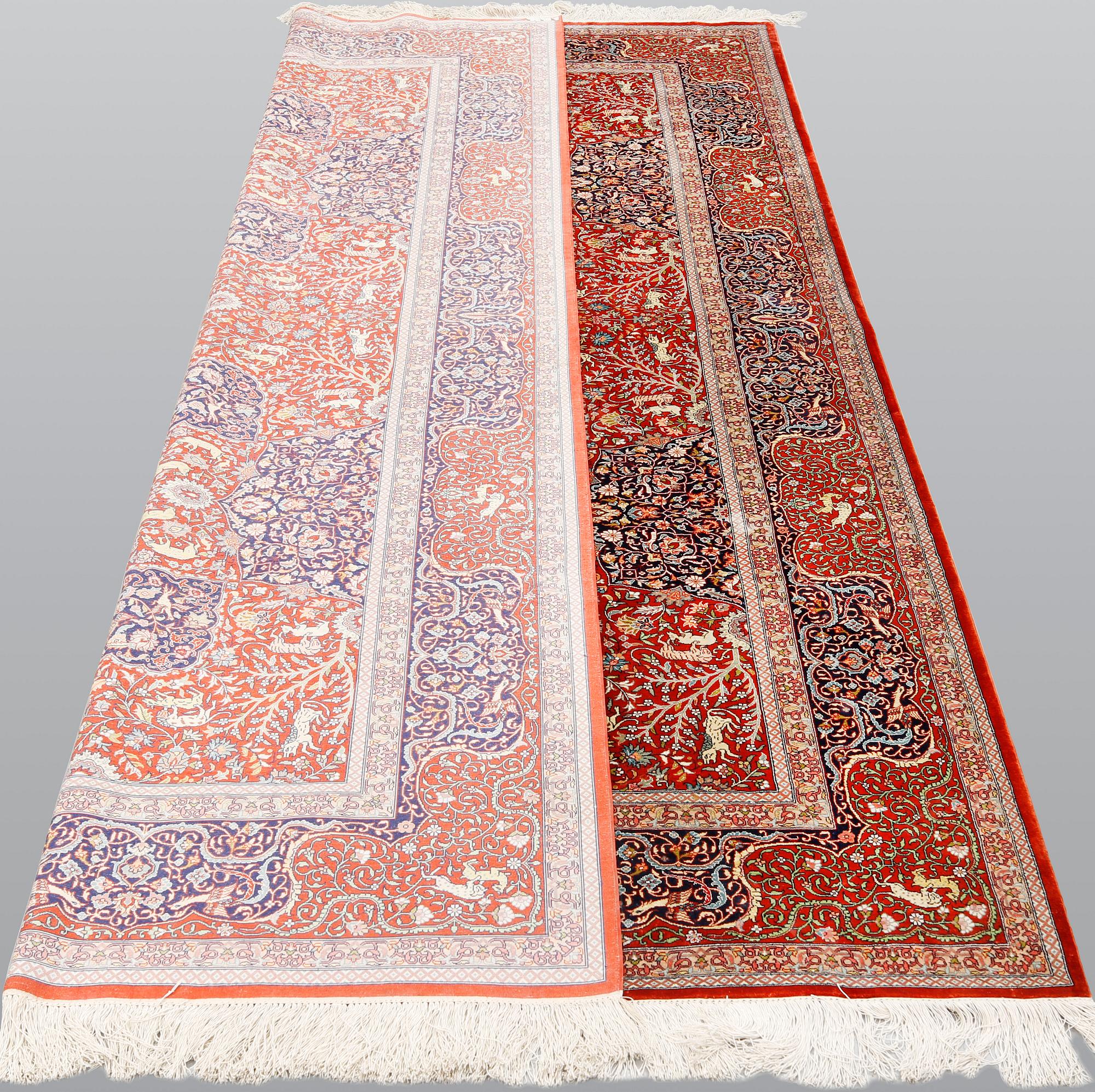 A pictoral orietal silk rug, 246 x 153 cm.