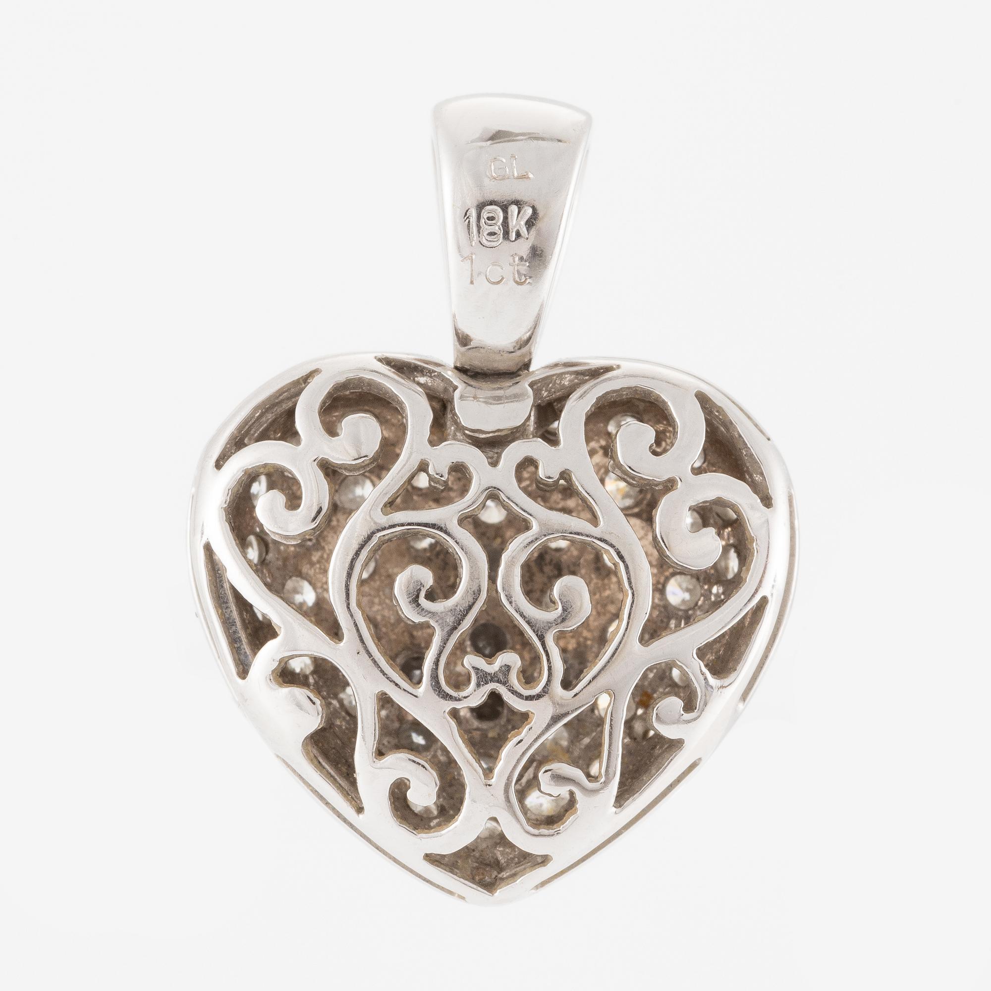 Pendant in the shape of a heart, 18K gold with round brilliant-cut diamonds.