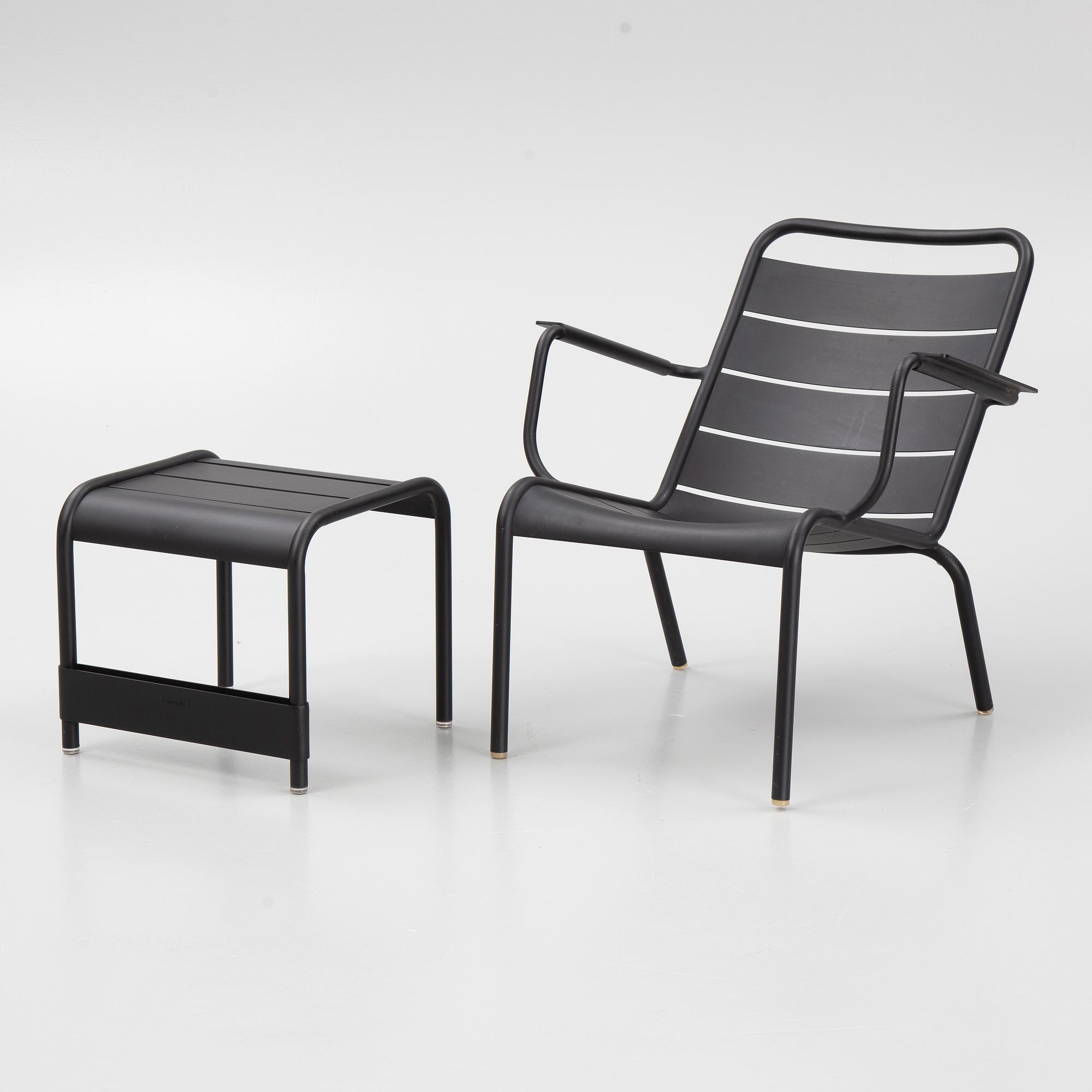 A 'Luxembourg' lounge chair and a foot stool, Fermob.